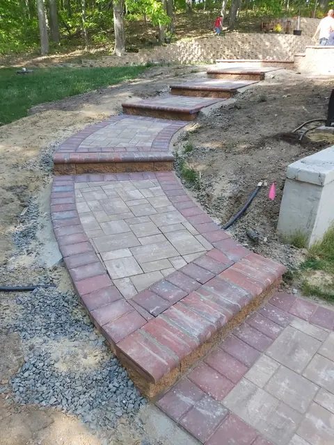 Curved paver walkway with steps