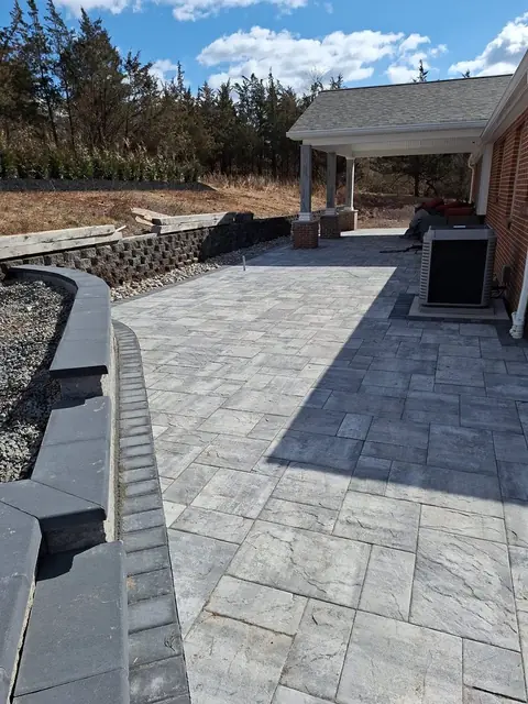 Paver patio with a block retaining wall